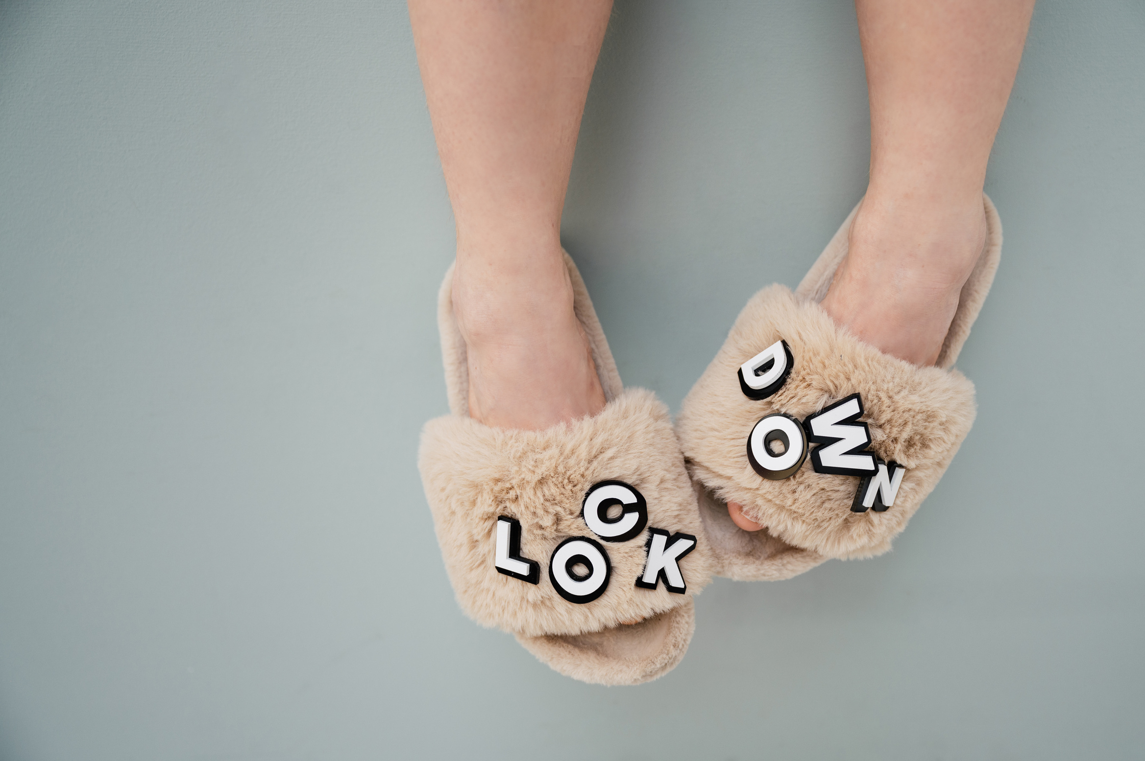 Person Wearing Brown House Slippers